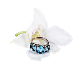 White orchid and ring with topazes