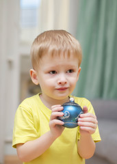 the kid with a Christmas ball