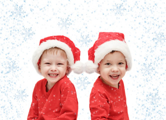 the three-year-old  twins childs in Santa Claus