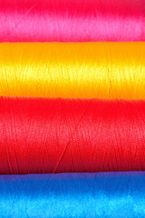 Varicolored spools thread macro