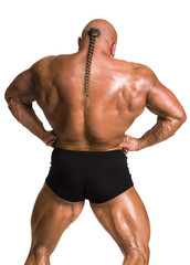 Athlete bodybuilder demonstrating muscles of the back and arms