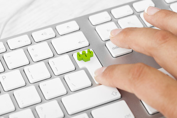 Woman pushing teamwork key on keyboard