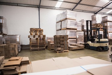 Forklift in a large warehouse