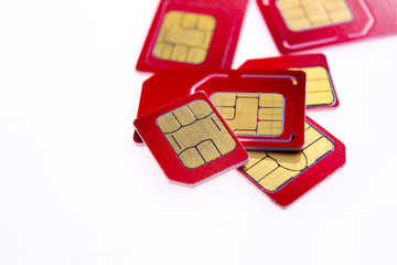 Stack of red sim card on white background