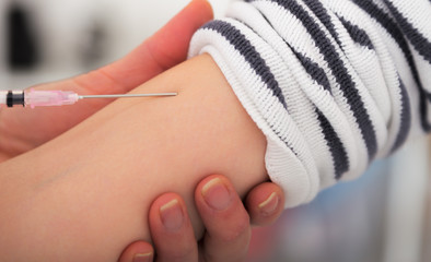 Doctor giving an injection to a patient