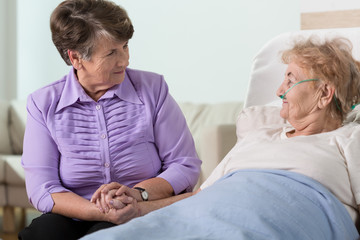 Senior woman caring about sister