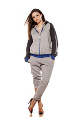 front view of young woman in track suits and high heels