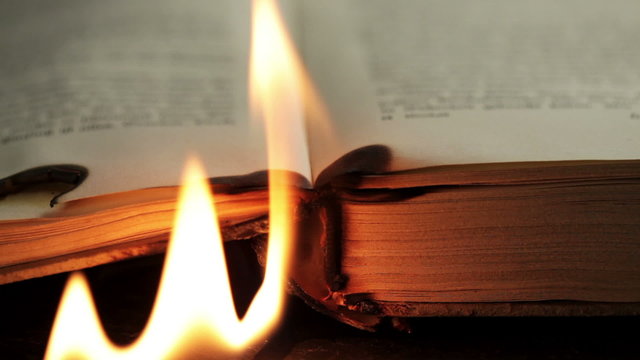 Burning pages of an antique book