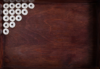 Cheerios lining as angle into dark wood box
