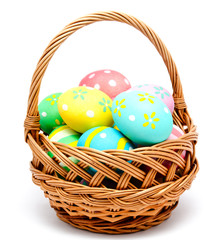 Colorful handmade easter eggs in the basket isolated - 77988436