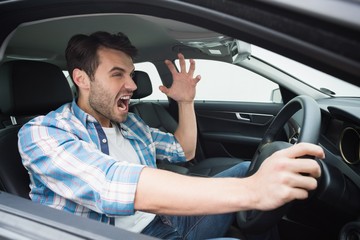 Young man experiencing road rage