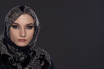 portrait of young beautiful muslim woman with head scarf