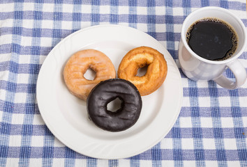 Three Donuts with Cup of Coffee