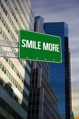 Obraz premium Smile more against low angle view of skyscrapers