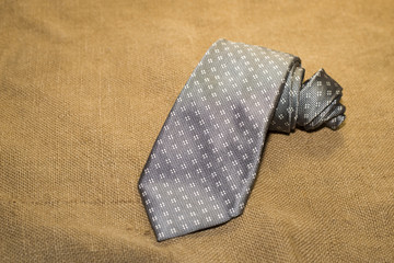 Folded grey tie on the old tissue