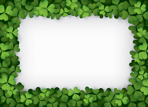 Frame of green clover leaves