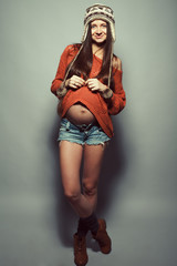 Fototapeta premium Stylish pregnancy concept. Portrait of happy pregnant woman