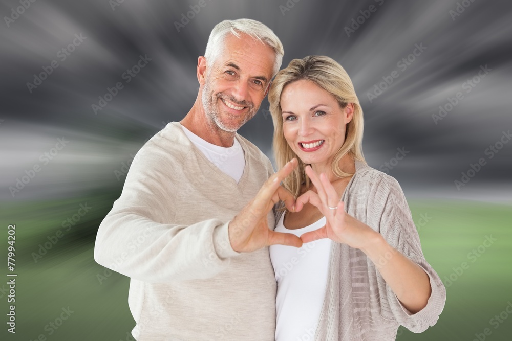 Aufkleber composite image of happy couple forming heart shape with hands