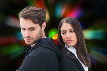Composite image of unhappy couple not speaking to each other