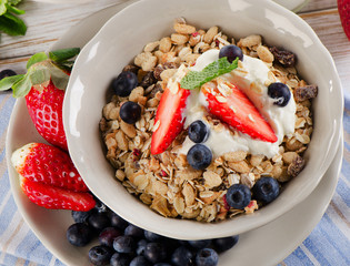  Breakfast -  berries, yogurt and  muesli.