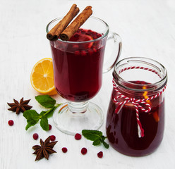 Glasses of mulled wine with lemon and cranberries