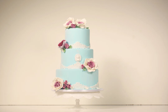 blue wedding cake with roses