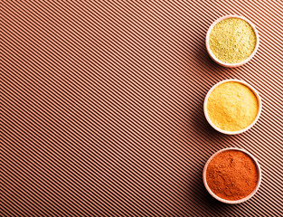 hops-suneli,turmeric,paprika in a wooden bowl