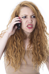 Model Released. Angry Young Woman Using Mobile Telephone