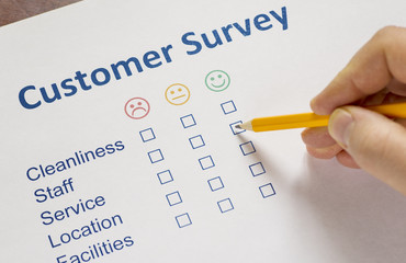 Man completing a customer survey