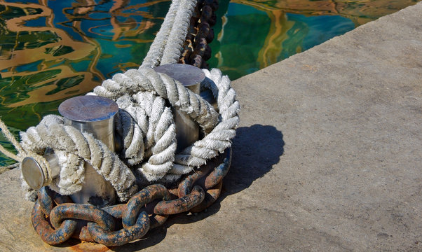 Bollard with the marine ropes and chains ship.