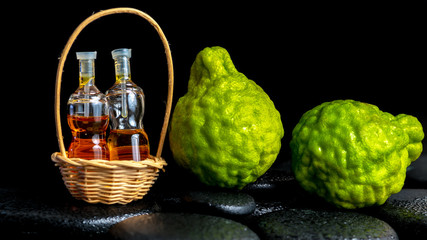 Aromatic spa concept of bergamot fruits and  bottles essential o