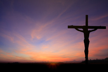 Dark Silhouette of Jesus with Cross over rainbow sunset concept for religion, worship, Christmas,...