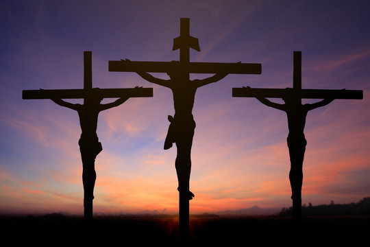 Silhouette of Jesus with Cross over rainbow sunset concept for religion, worship, Christmas, Good Friday, Easter, Jesus he is risen, Thanksgiving prayer and praise, promise