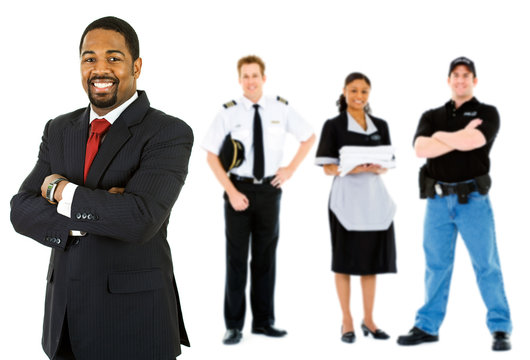 Occupations: Businessman Stands at the Front of Employee Group