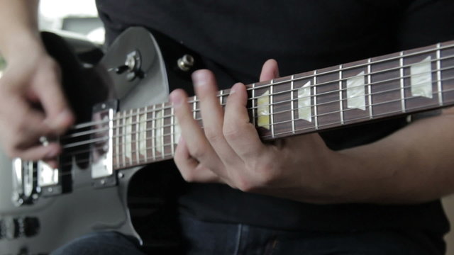 Guitarist play on electric guitar