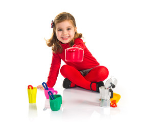 Surprised little girl playing cooking