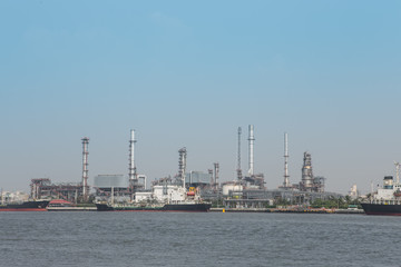 Fototapeta na wymiar Oil refinery plant with blue sky background