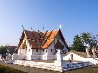 Fototapeta na wymiar Church of Wat Phu Mintr under blue sky