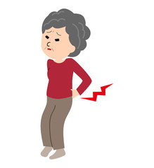 An elderly woman suffering from a back pain