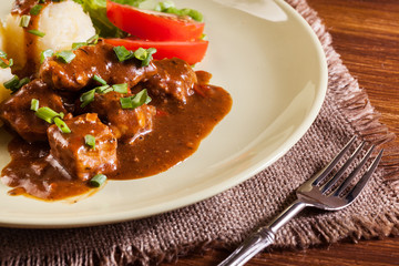 Goulash with boiled potatoes