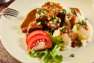 Goulash with boiled potatoes