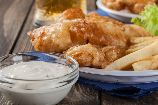 Fish and chips with tartar sauce on a plate
