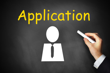 hand writing application on black chalkboard
