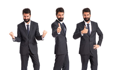 Businessman with thumb up over white background