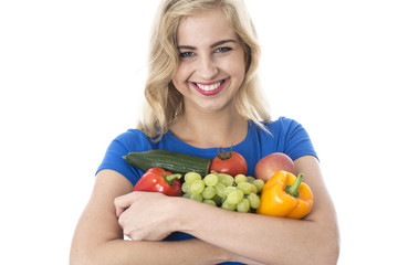 Young Woman Holding a Selection of Fruit and Vegetables