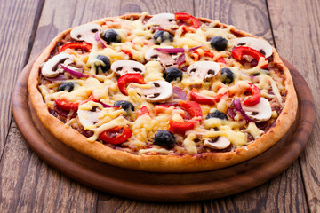 Pizza with seafood on wood table