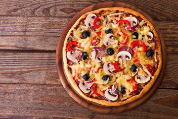 Pizza with seafood on wood table top view
