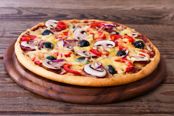 Pizza with seafood on wood table