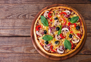 Pizza with seafood on wood table top view