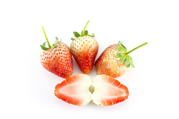 Strawberries Berries with a half section on white